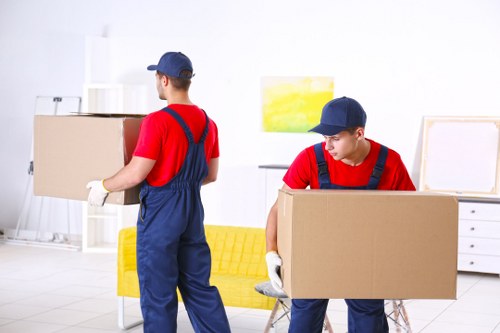 Removal team handling boxes during a house move
