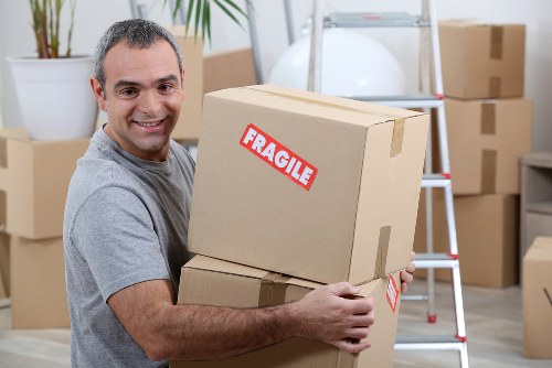 Removal team protecting furniture during a Westbrompton house move