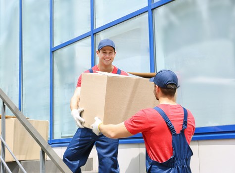 Removal team planning a home move in West Brompton street with moving van