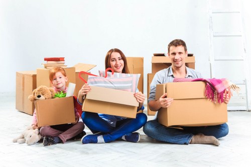 Residential moving team handling furniture in Westbrompton