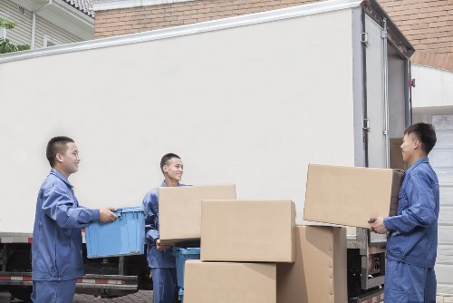 Packed boxes and household items ready for van transport