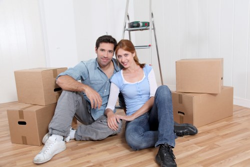 Furniture and boxes being loaded into a moving van