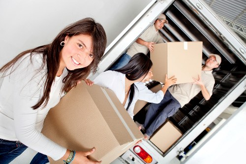 Packed boxes and furniture prepared for transport in Westbrompton