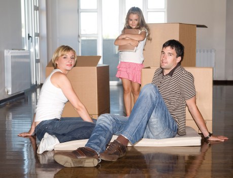 Boxes and furniture being loaded into a removal van